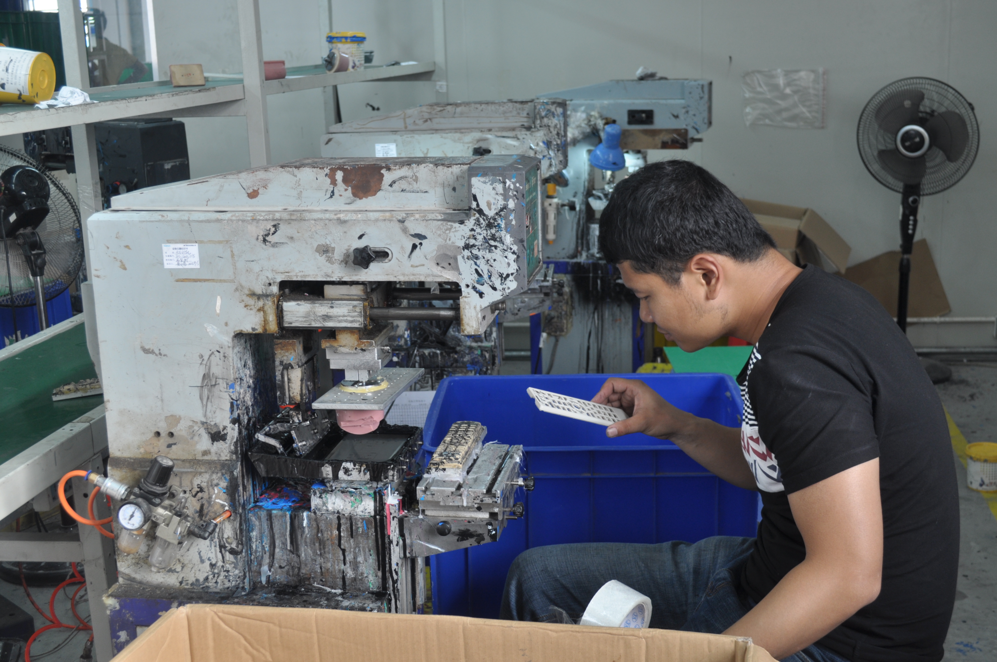 Operator assembling finished units at a production station